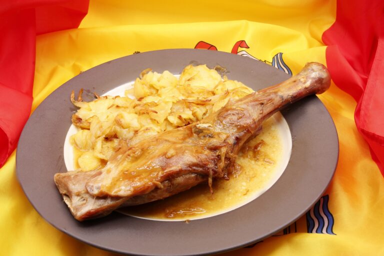 Roasted,Lamb,Shoulder,With,Chips,,On,The,Flag,Of,Spain,