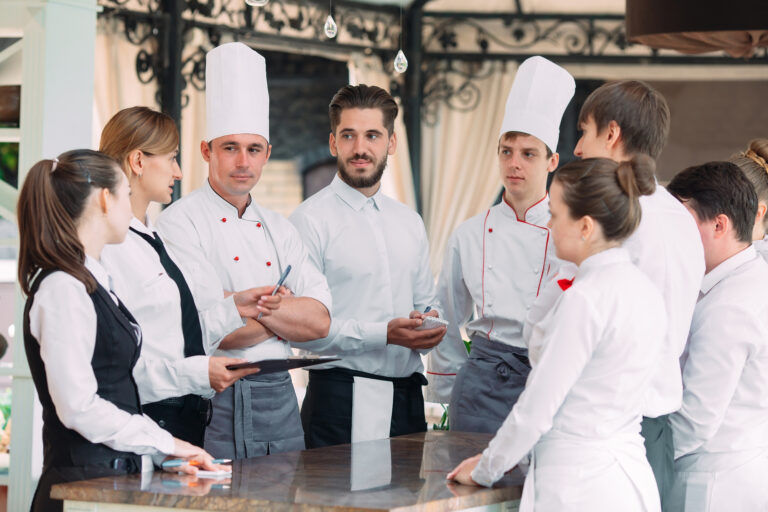 Restaurant,Manager,And,His,Staff,In,Terrace.,Interacting,To,Head